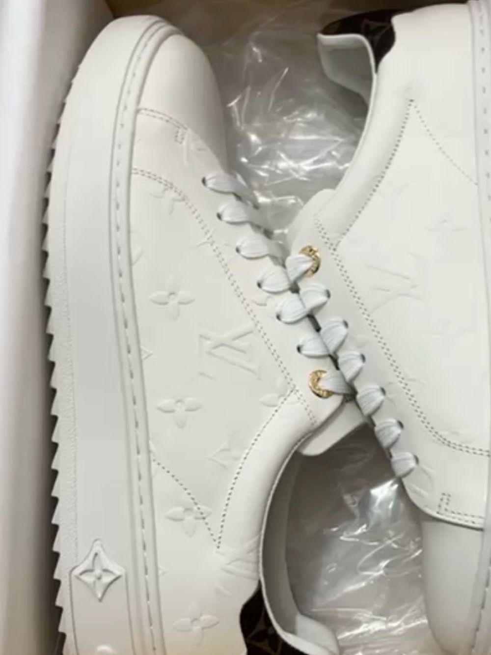 Louis Vuitton White Embossed Monogram Sneakers with Gold Accents